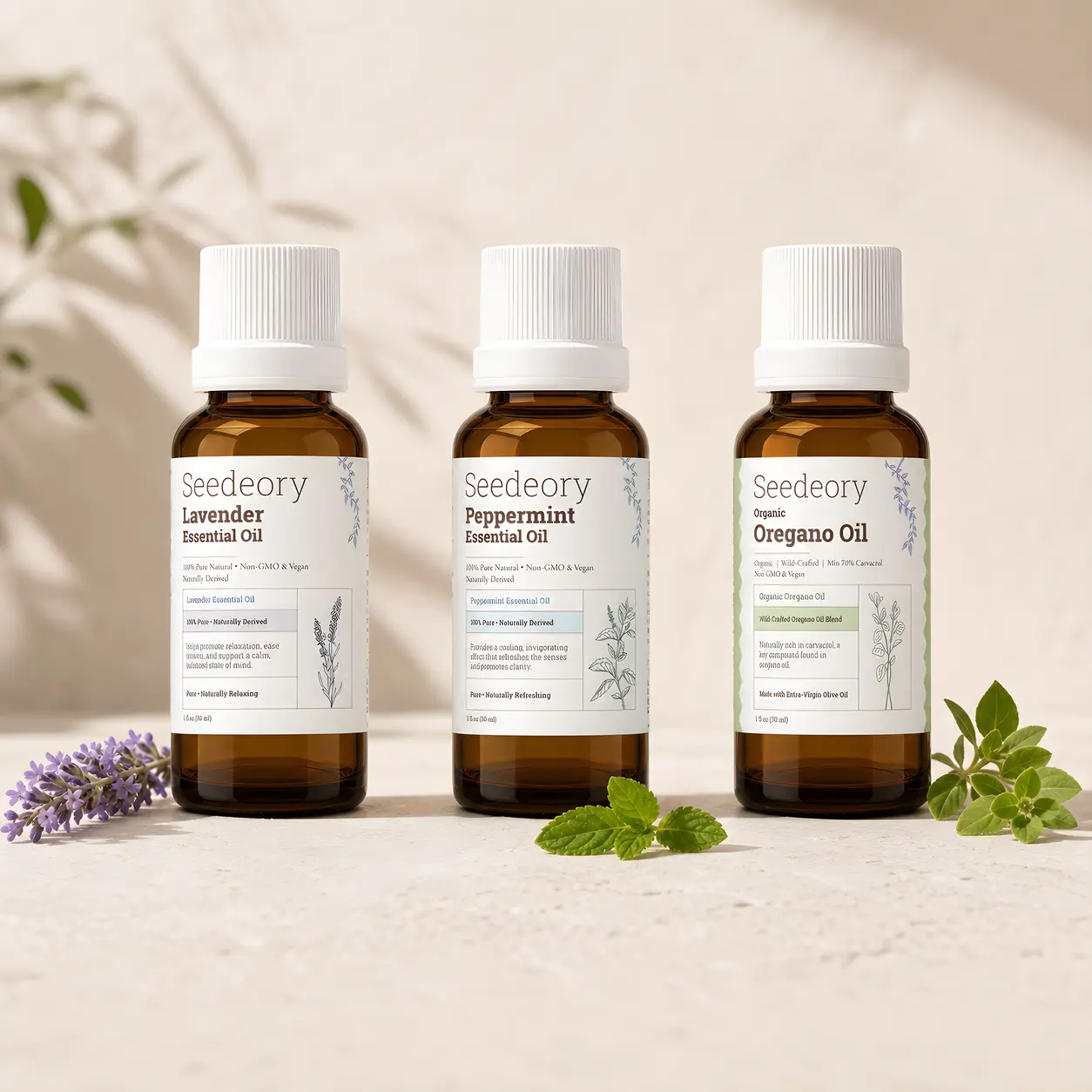 Seedeory lavender, peppermint, and oregano oils displayed with matching botanicals
